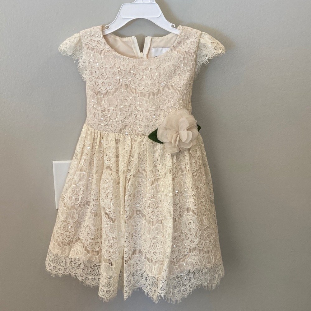 Dress,cream color sequins, zipper and bow in the back